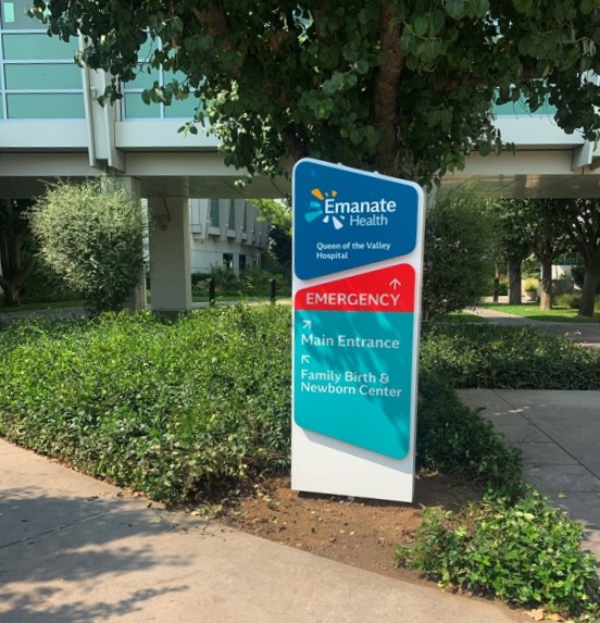 Emante Health Wayfinding sign at a Hospital pointing to the Emergency, Main Entrance, and Family Birth & Newborn Center